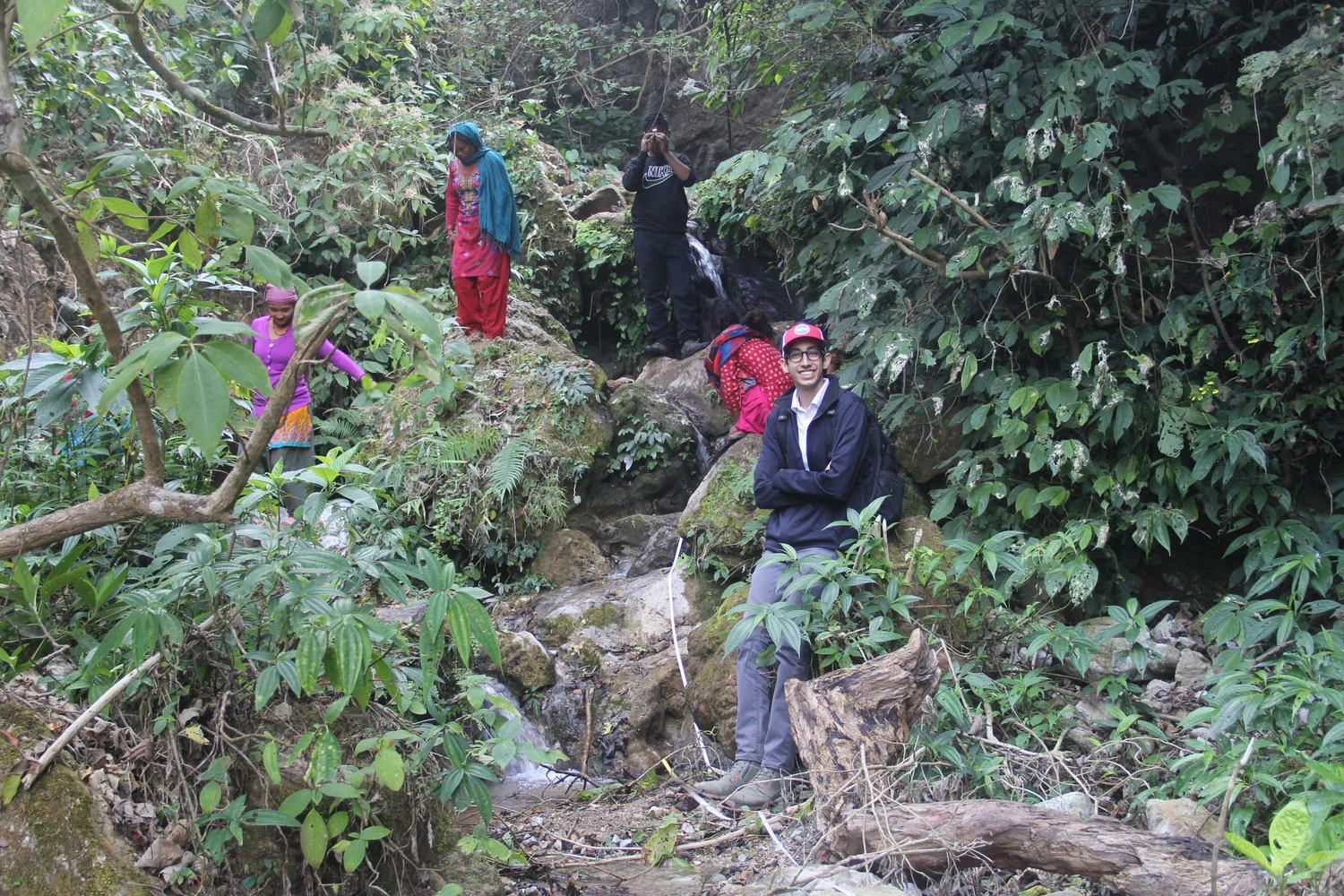 Nepal International Fellow Pavan Mudiam helps to outline a pipeline in Nepal. 