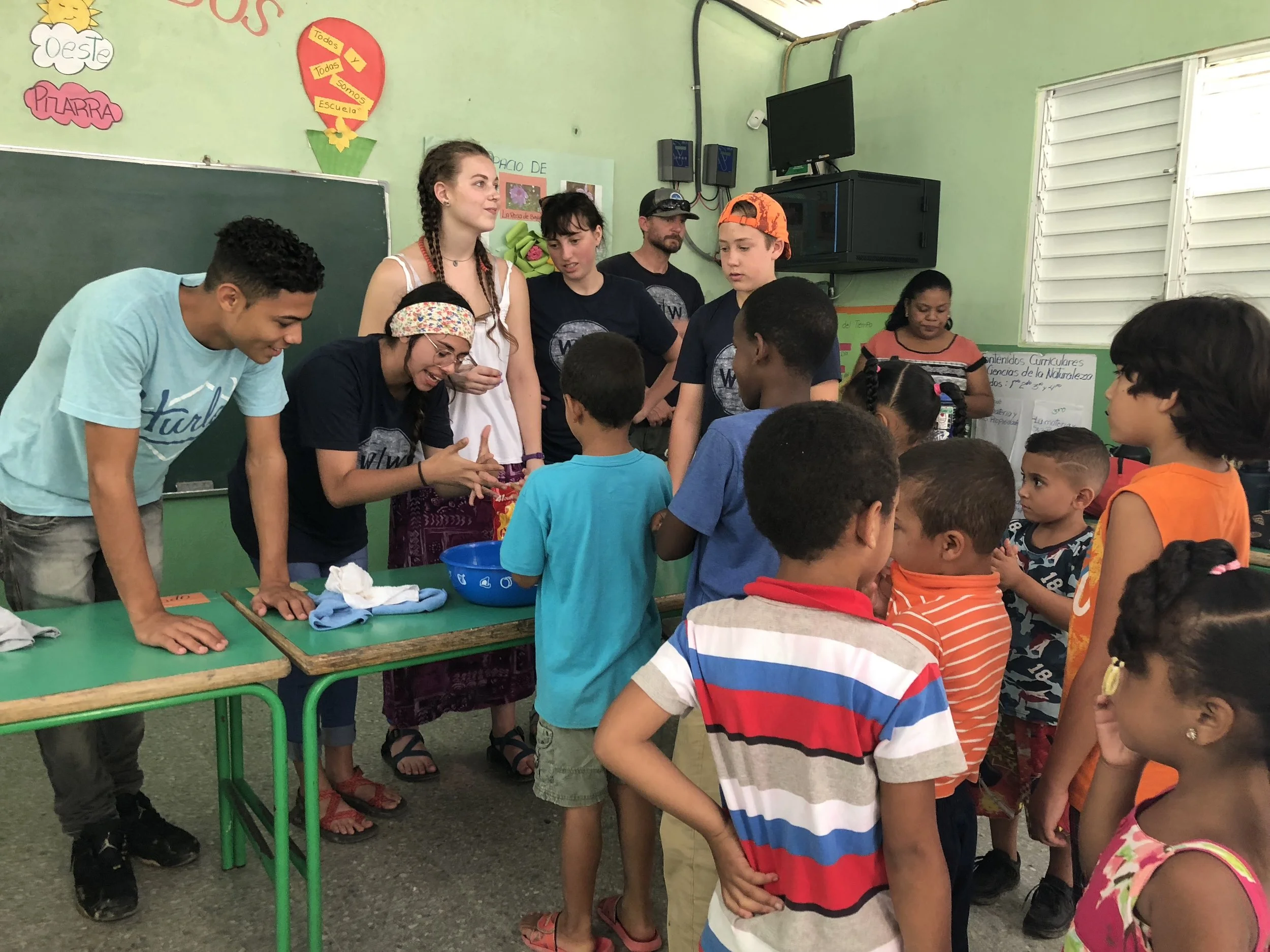 Volunteers teaching proper hand washing techniques in the Dominican Republic.