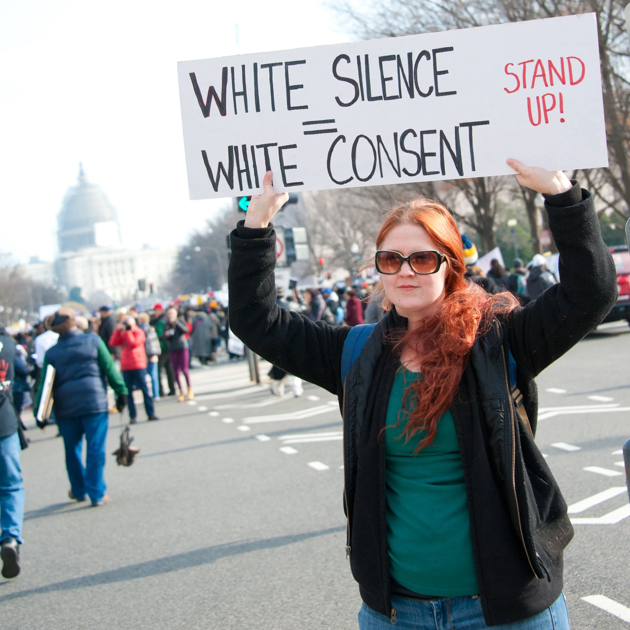 WASHINGTON - DECEMBER 13: A protester holds a sign during a march against police shootings and racism during a rally in Washington, DC on December 13, 2014. 