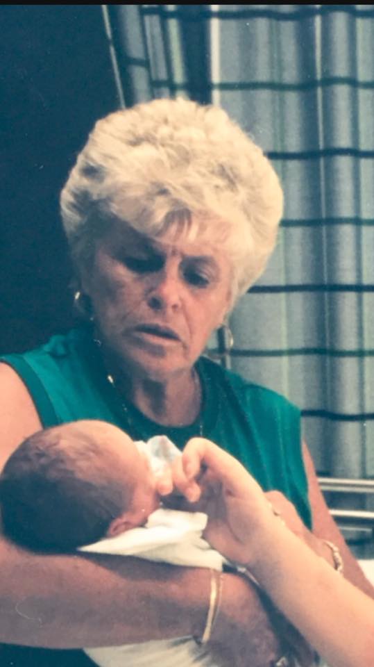 (picture is my mom holding my baby girl in the hospital: confident, wise, and loving) 