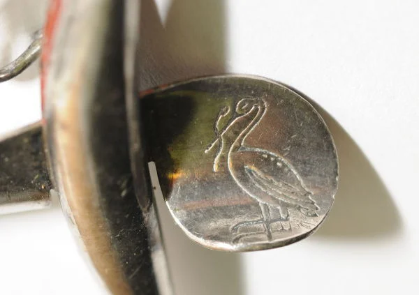 Sofie Stork's family owned the famous H Stork angling firm of Munich. Their 'stork' logo can still be found on fishing gear from the time. Notice how on the plate's back the same stork has been adapted to hold a swastika flag. 