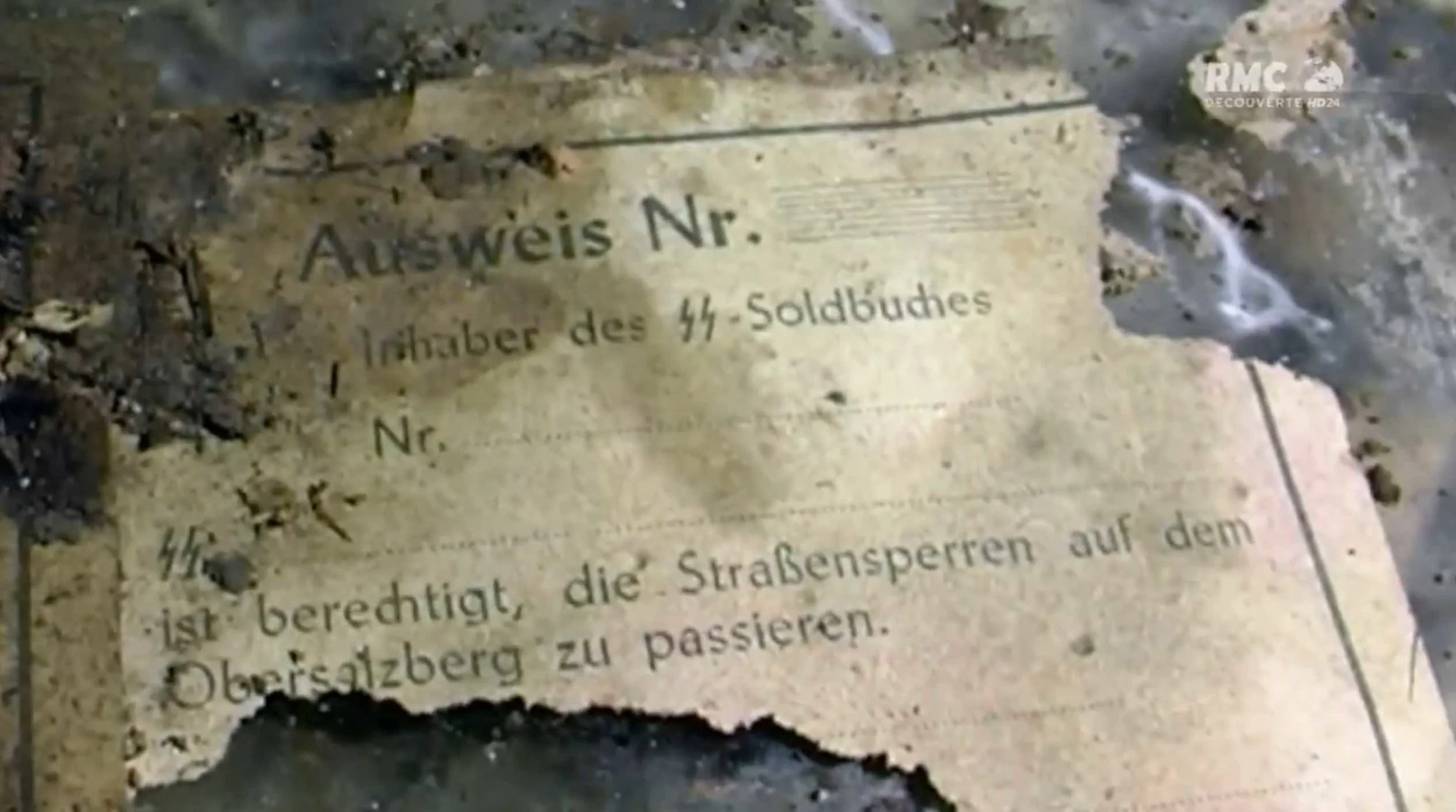 Remains of one of the above SS passes, found in a bunker under the Obersalzberg. 
