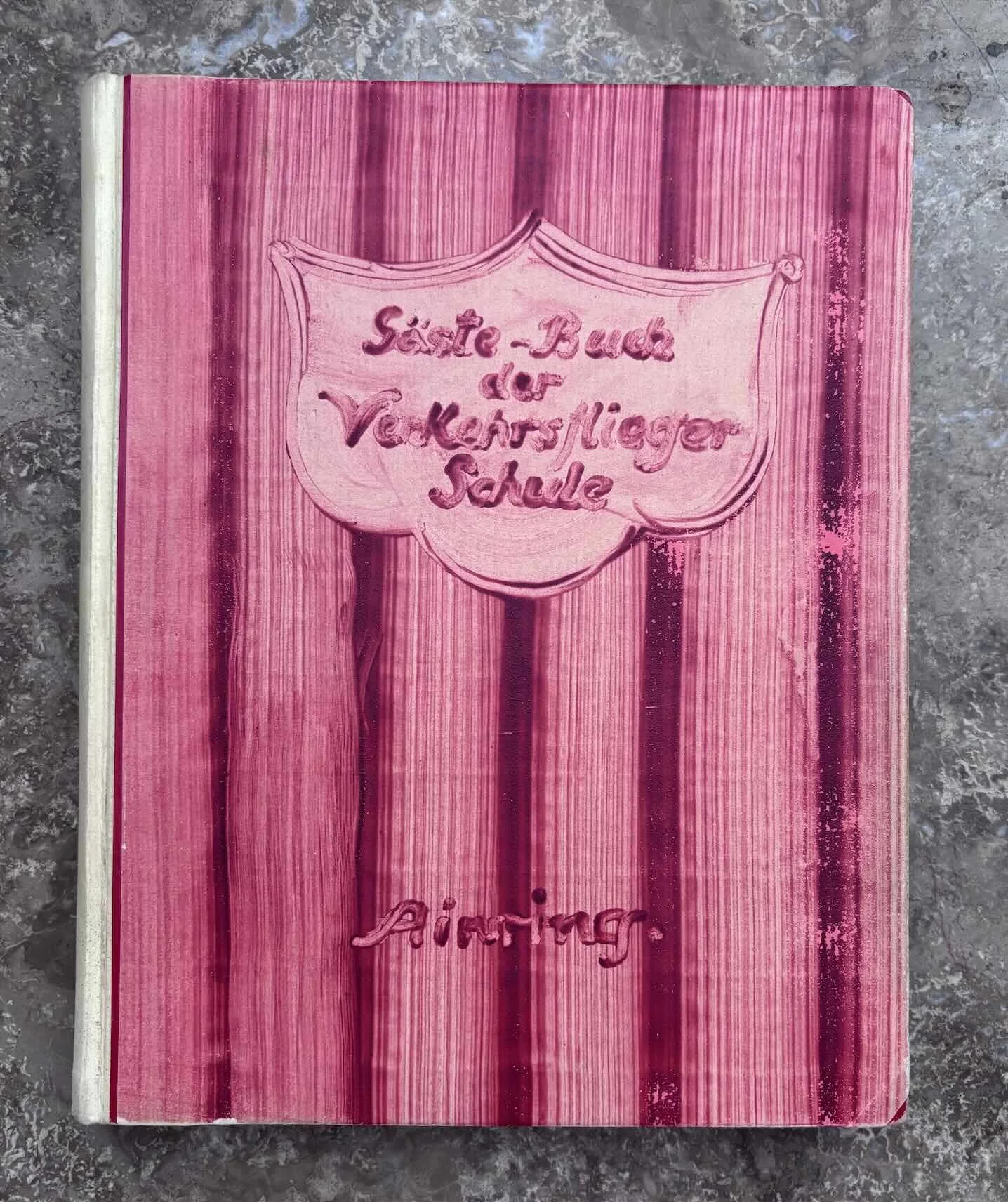   “Gäste-Buch der Verkehrsfliegerschule Ainring”  – “Guest Book of the Air Transport Pilots’ School, Ainring.” 