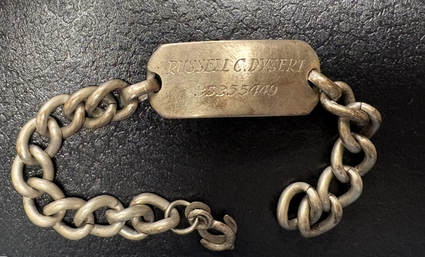 Sterling silver ID bracelet engraved to Russell C. Dysert.  