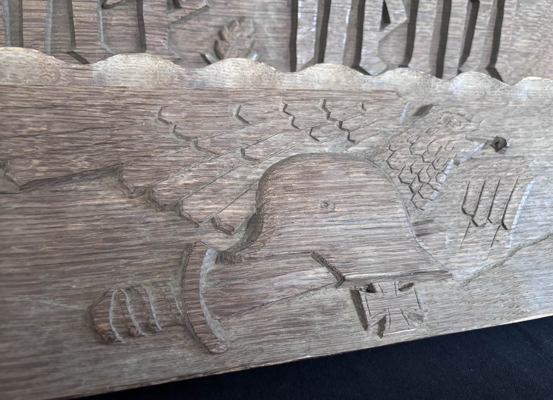  The surface of the carved  stahlhelm  feels noticeably smoother than other parts of the carving - possibly from years of passers-by instinctively reaching up to touch it as they walked beneath the guardhouse entrance.  