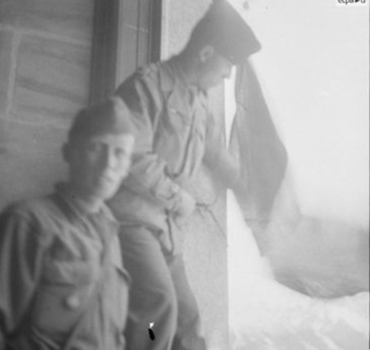  Men of Bonnet’s unit, the 64th artillery regiment of the 2nd Armored Division (64th RADB), at the Eagle's Nest on May 4, 1945. Here, the tricolour flag is hung in one of the windows by Captain Laurent Touyeras and his deputy, Cadet.  