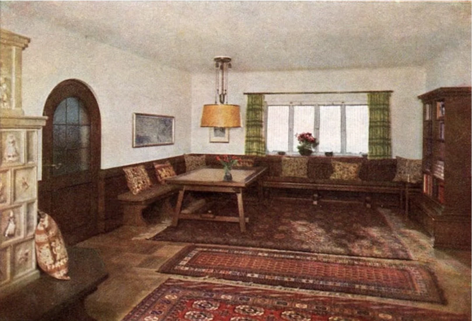  Pictured here on the far left, Sofie Stork’s handpainted  kachelofen  (tile stove) was something of an architectural talking point within the Berghof – and a place where staff and guests would gather for warmth on cold evenings. 