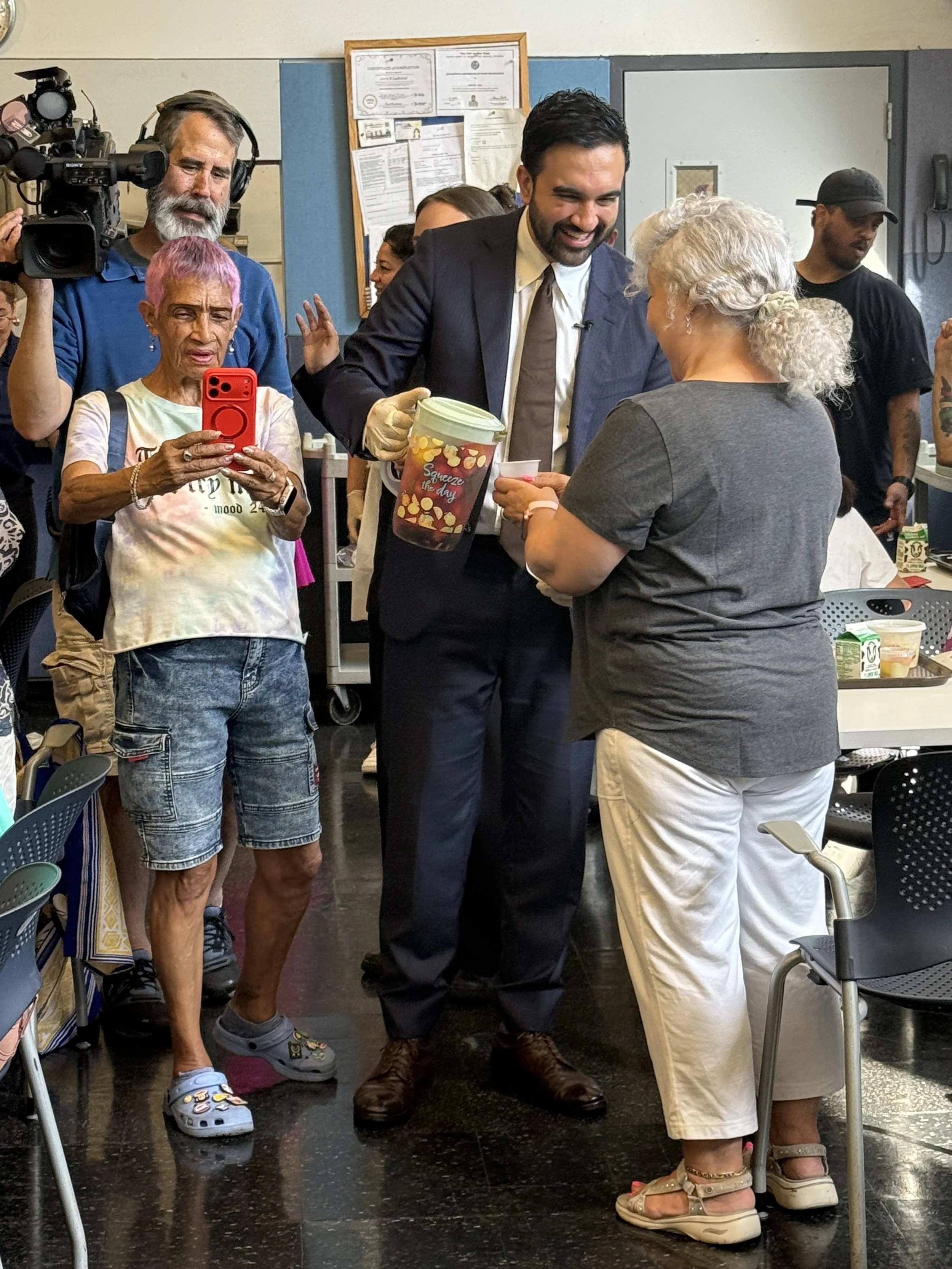 Mayor Mamdani pouring cold beverages for our clients