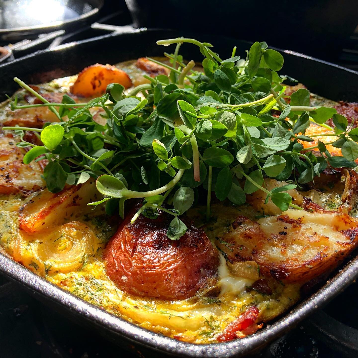 Good morning larded potato frittata.
It always makes my heart smile when I can make something with 100% locally sourced ingredients. 
Potatoes and onions from pineknot farms, lard from @jirehfamilyfarm , eggs from 4M, herbs from me, peashoots from @f