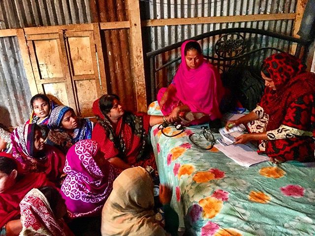 In Bangladesh with the Vietnamese CEP team at one of SAJIDA's group meetings. the health worker is checking the customers' blood pressure and loan officer is taking loan repayments. #optixproject #bilateravisit