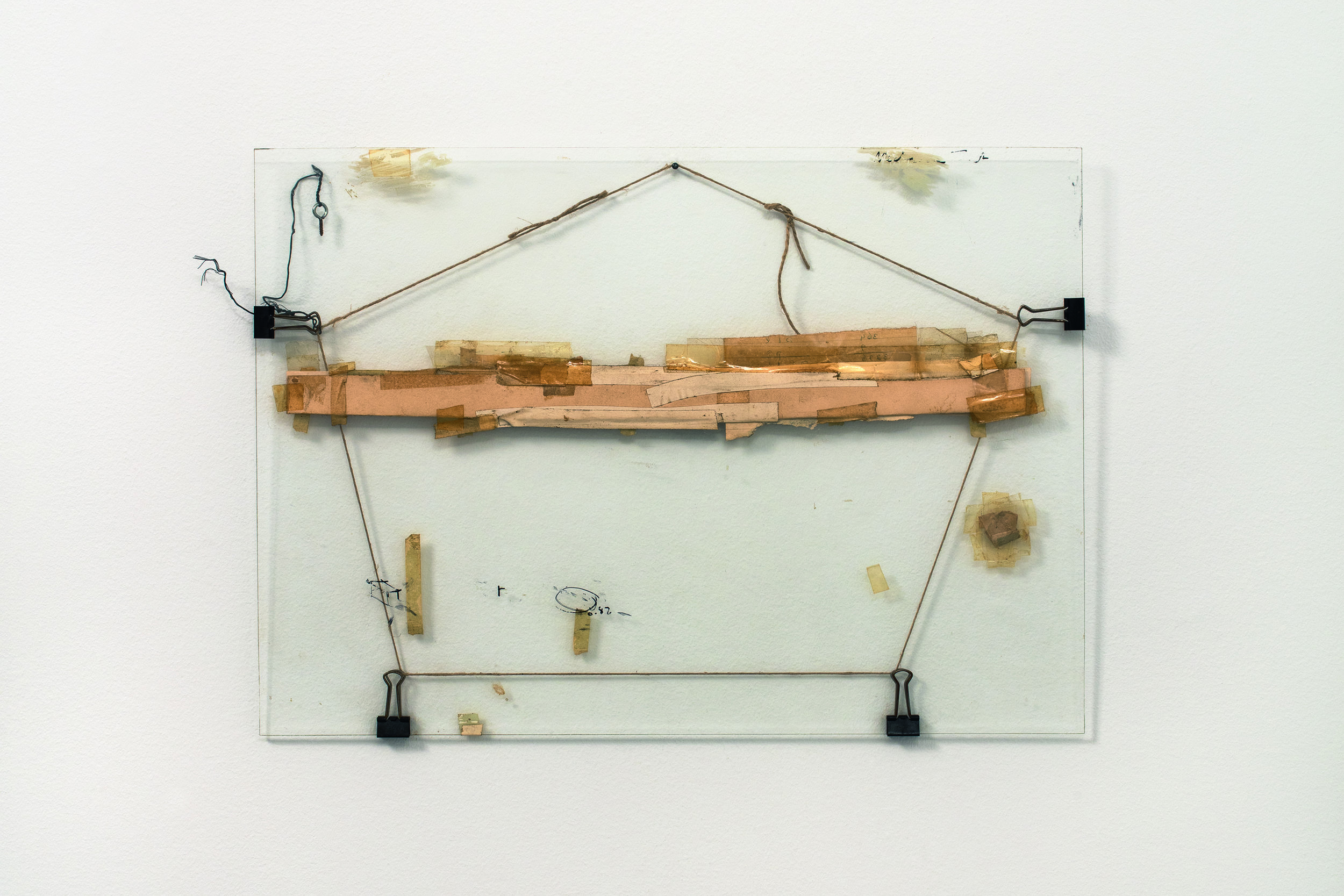  Nahum Tevet, Untitled #3, 1972, restored by the artist, 2016. Cardboard, binder clips, twine, wire, screw eye, masking tape, transparent tape, plastic tape, marker, and wax pencil on glass, 13 3/4 x 19 3/8 x 7/16 in. (34.9 x 49.2 x 1.1 cm). Collecti