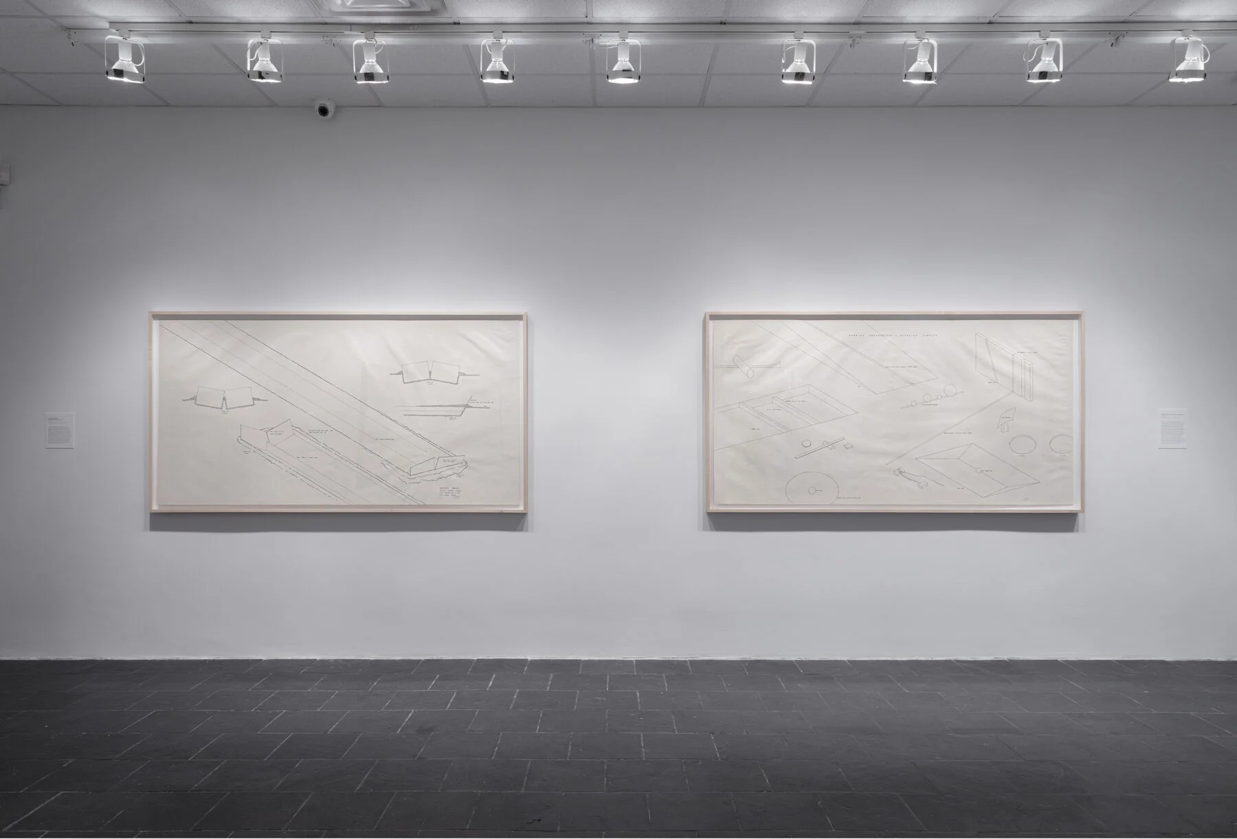 Installation view: Robert Morris: Para-architectural projects , Hunter College Art Galleries, 2019.LEFT: Observatory Markers, Equinox Sunrise–Sunset , 1971. Ink on paper, 42 x 82 ½ in. (107 x 210 cm). Estate of Robert Morris, courtesy Castelli Gallery, New York.RIGHT: Morning Observatory Exercise Complex , 1971. Ink on paper, 42 x 82 ½ in. (107 x 210 cm). Estate of Robert Morris, courtesy Castelli Gallery, New York. © 2019 The Estate of Robert Morris / Artists Rights Society (ARS). Photo: Stan Narten