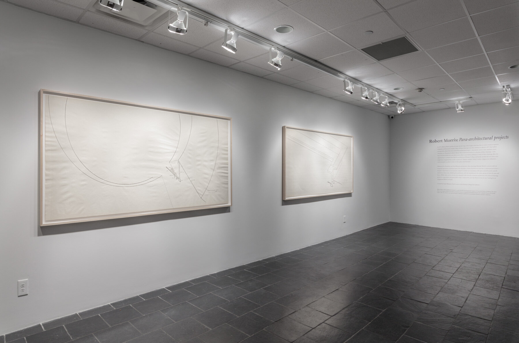  Installation view:  Robert Morris: Para-architectural projects , Hunter College Art Galleries, 2019. LEFT:  Section of an Enclosed Courtyard , 1971. Ink on paper, 42 x 82 ½ in. (107 x 210 cm). Estate of Robert Morris, courtesy Castelli Gallery, New 
