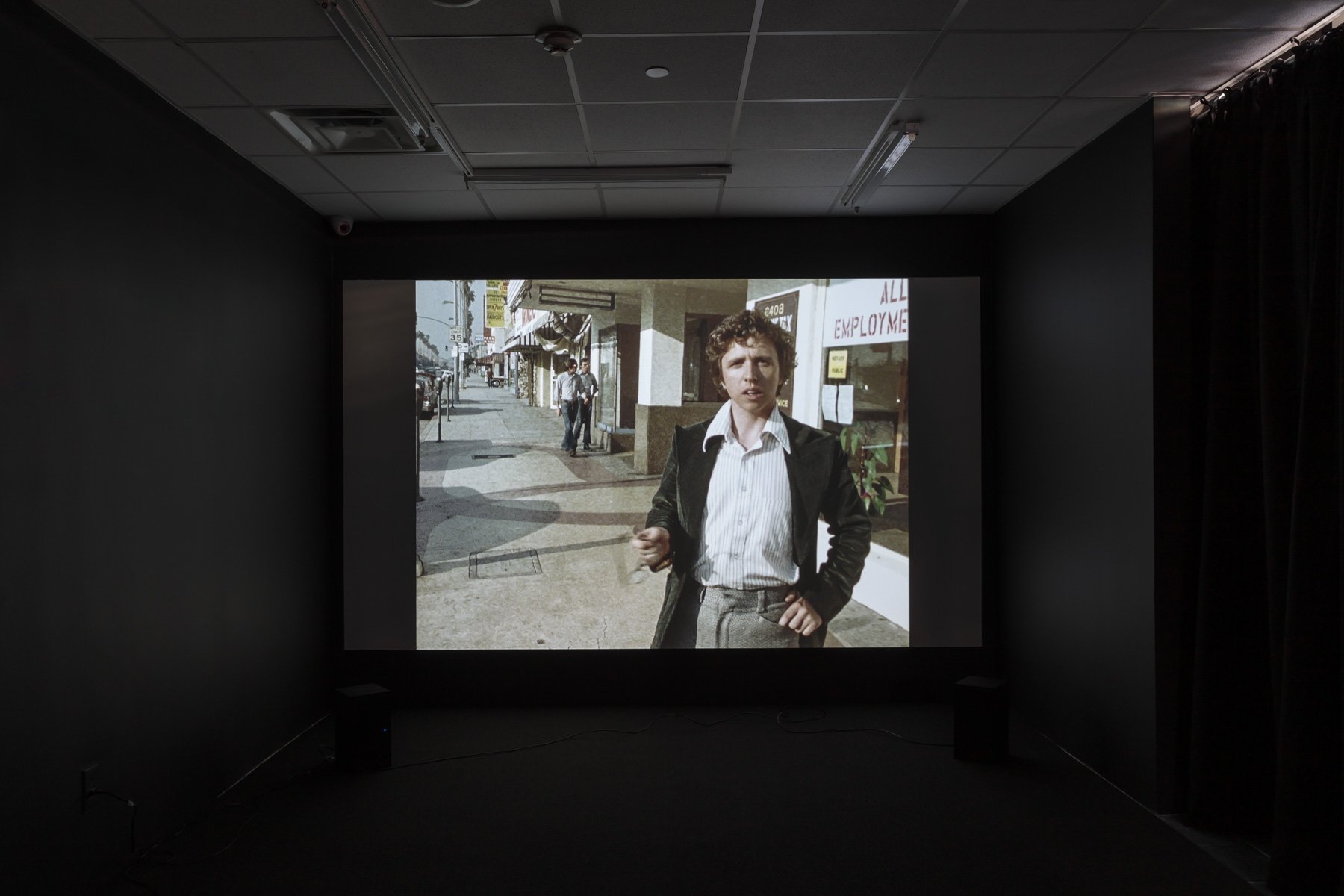  Still from  The Desert People , 1974, installed in  Life as Activity: David Lamelas  at Hunter College Art Galleries’ Leubsdorf Gallery, 2021. Digital video transfer from 16 mm film; 47 minutes, 7 seconds. Courtesy of the artist and LUX, London. Pho