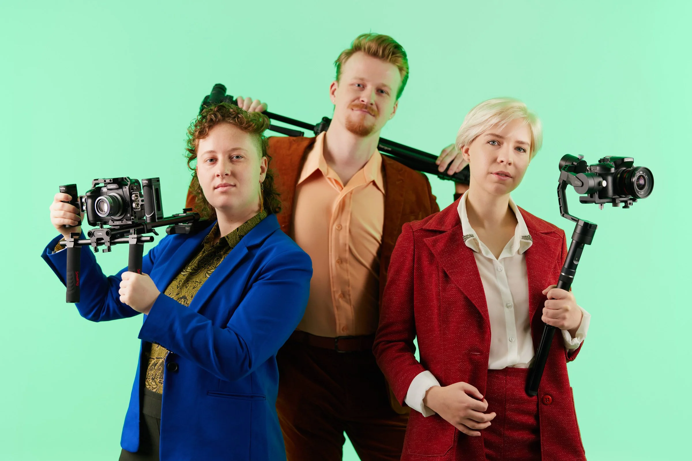 videographers-studio-portrait-green-background-production-team.jpg