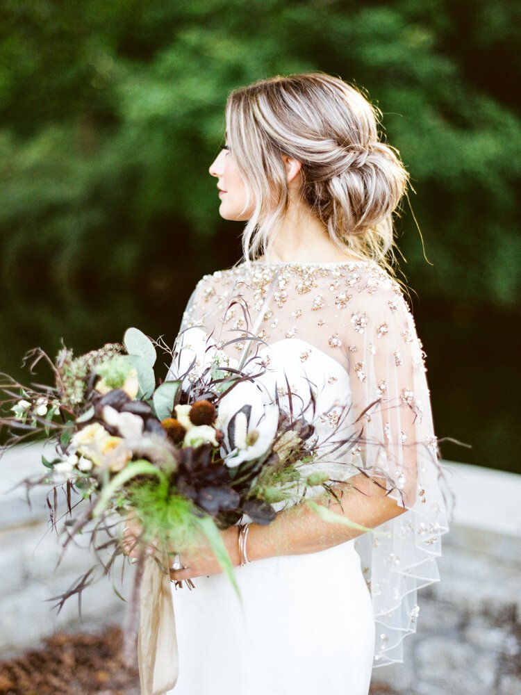  bride with bouquet designed by florist in Louisville Kentucky 