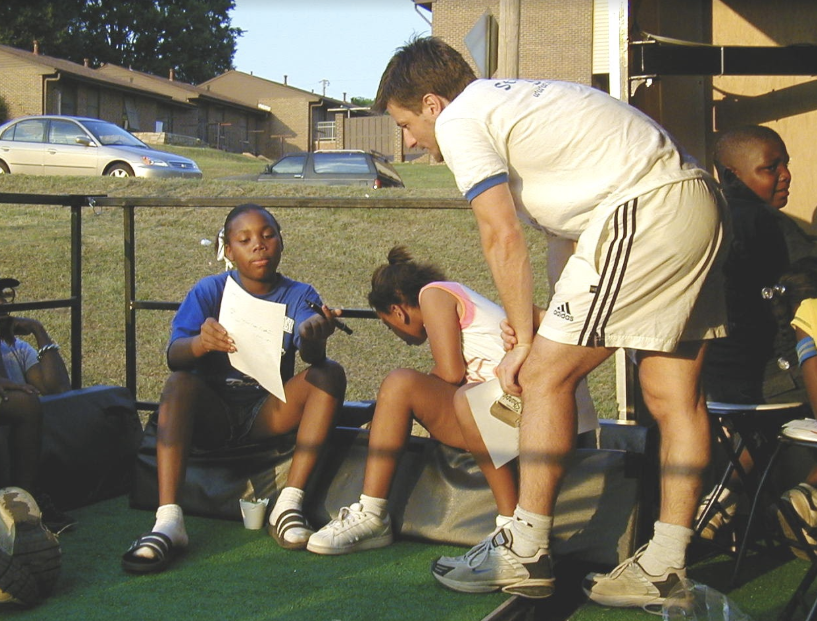  Soccer in the Streets youth players working with now SITS Executive Director, Phil Hill 