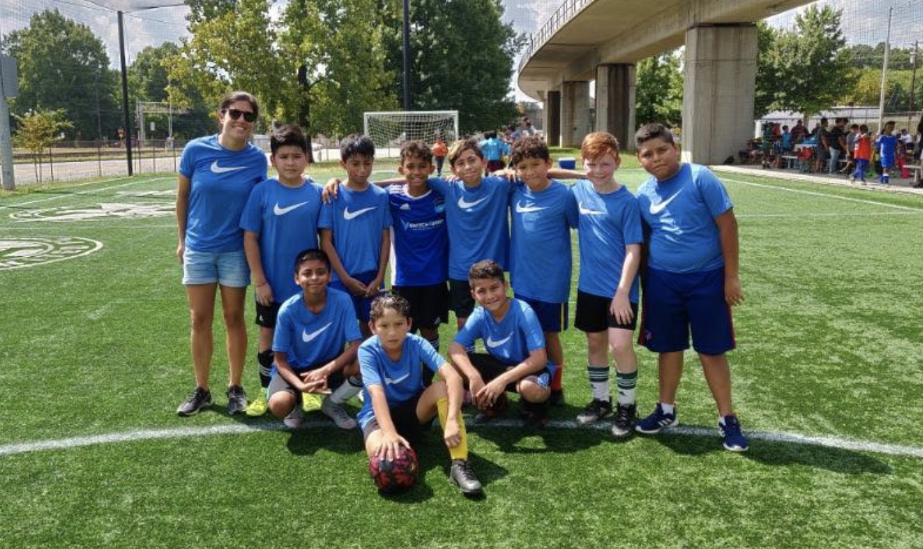 Coach Katie Carlson with youth players