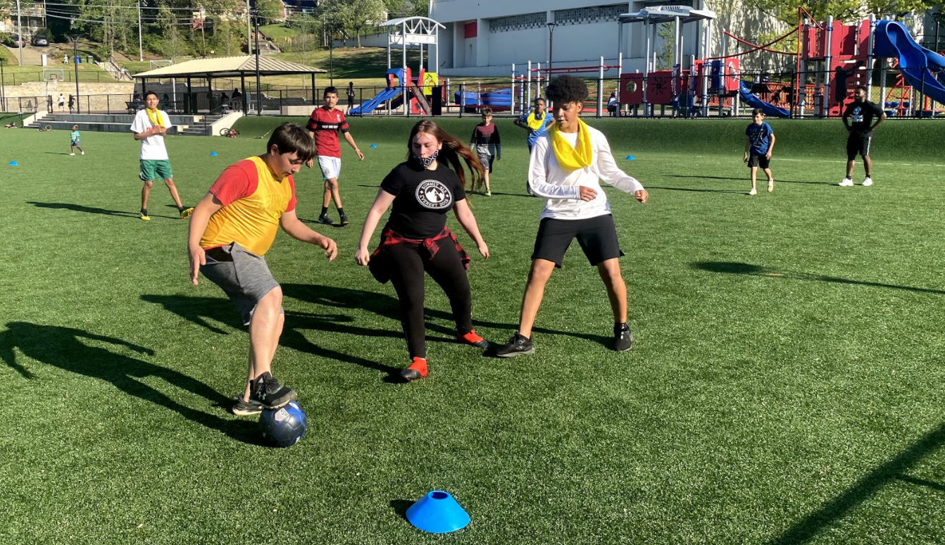 Vine City Player, Angelica defending player during practice