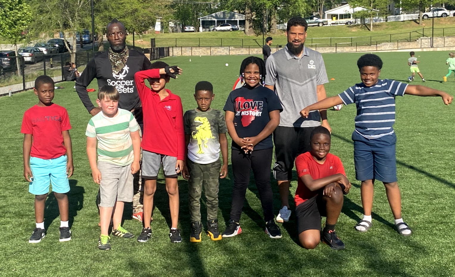 Coach Irving with players at practice