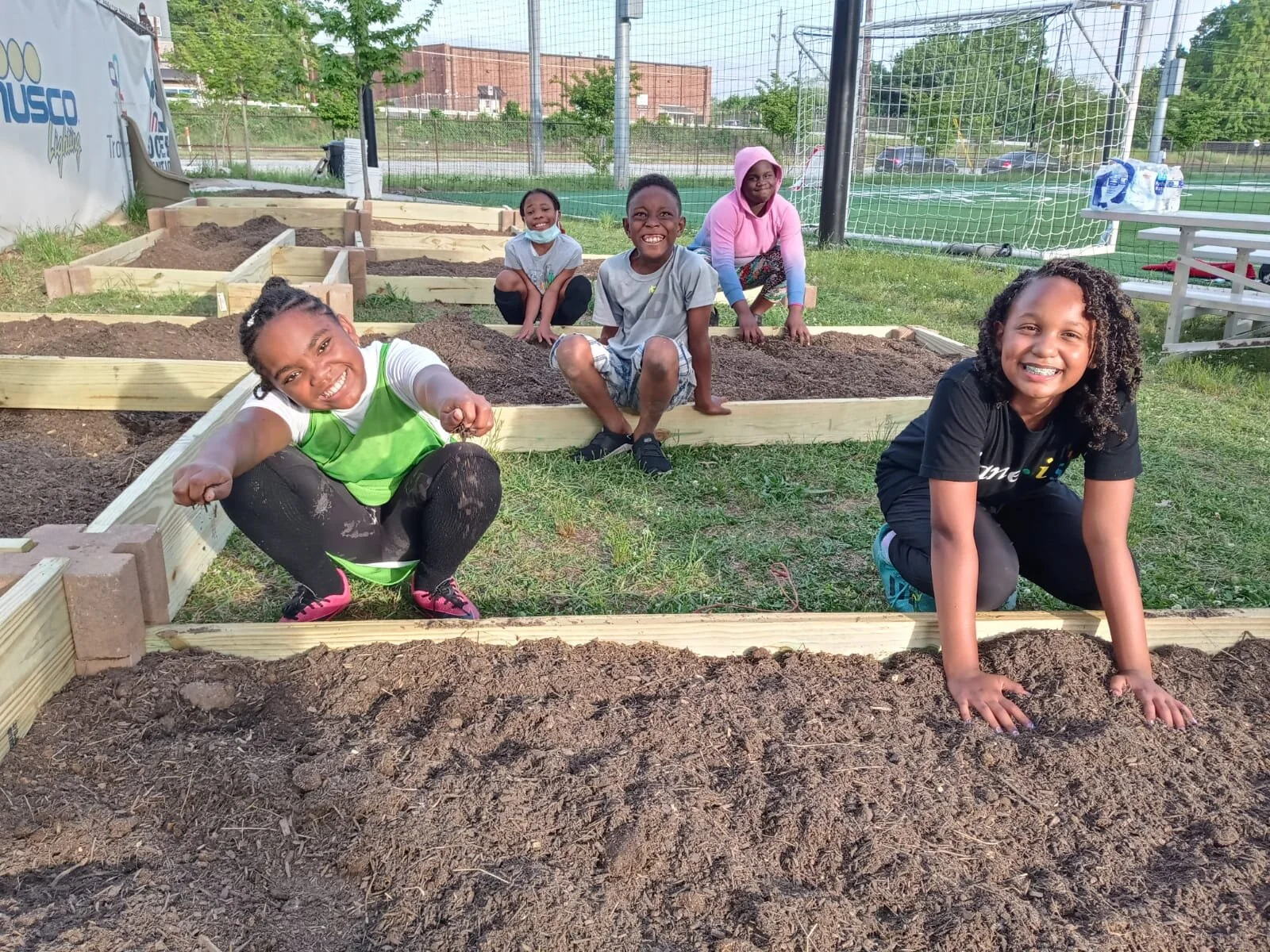 Kids building the garden bed