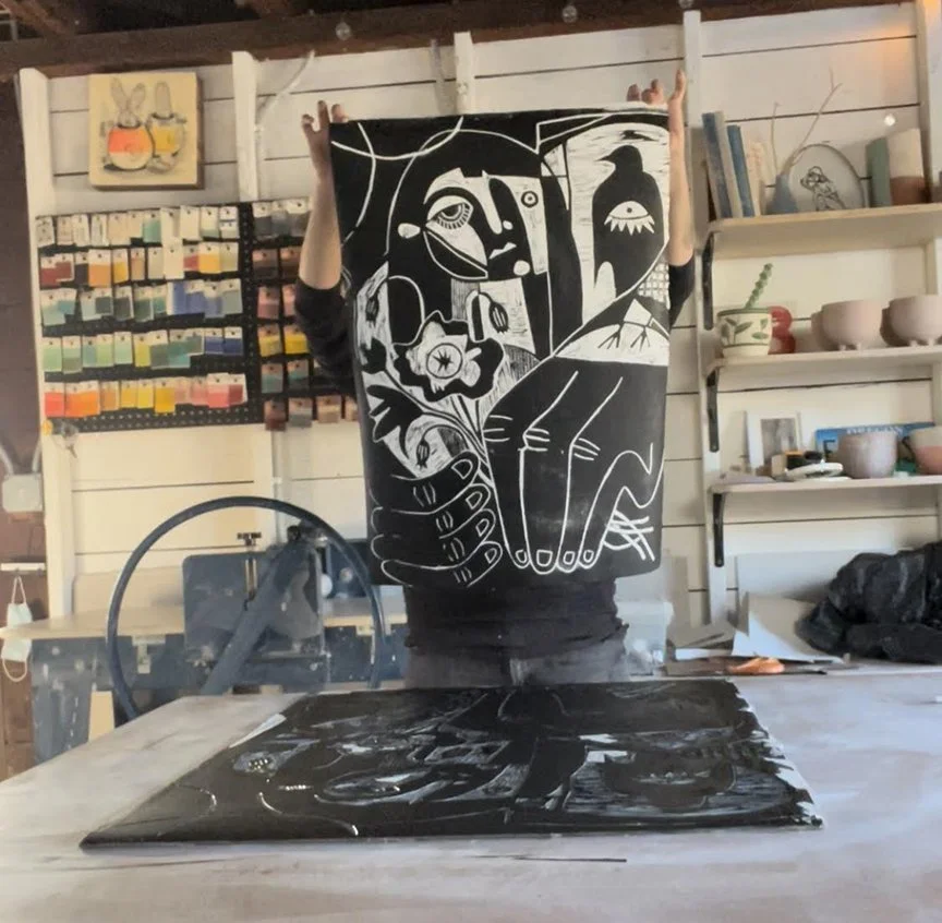 holding print in studio.jpg