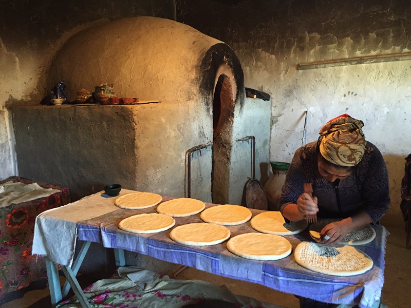  A Bukharan baker preps her  non  breads, giving them a signature stamp before they hit the oven Photo credit: Abdu Samadov 