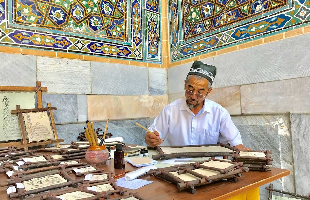A master calligrapher in Registan Square, Samarkand