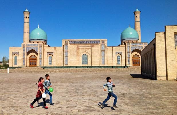 Children play near Tilya Sheikh Mosque in Tashkent