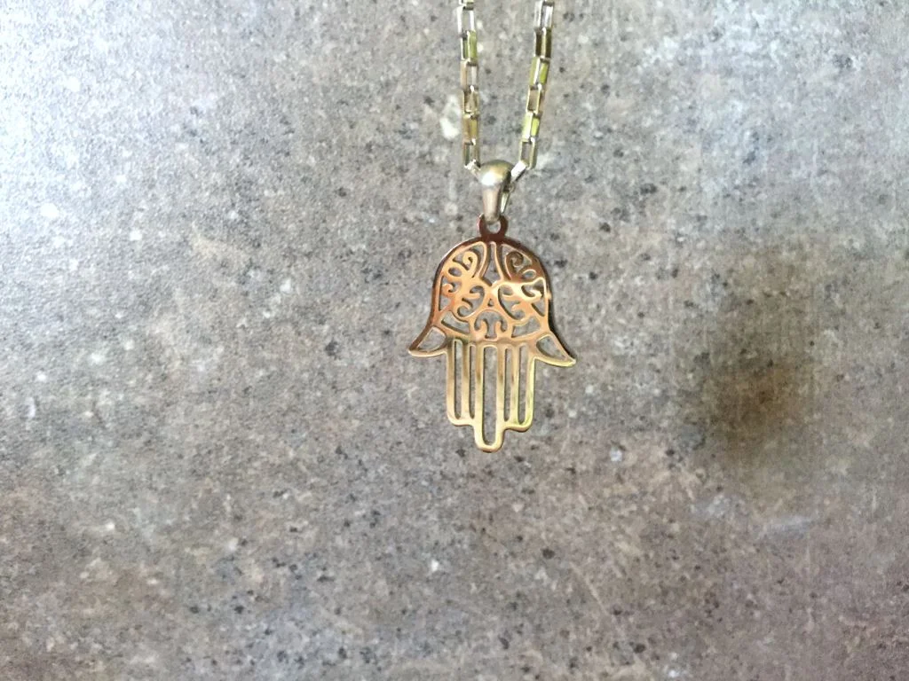 silver hamsa hand necklace