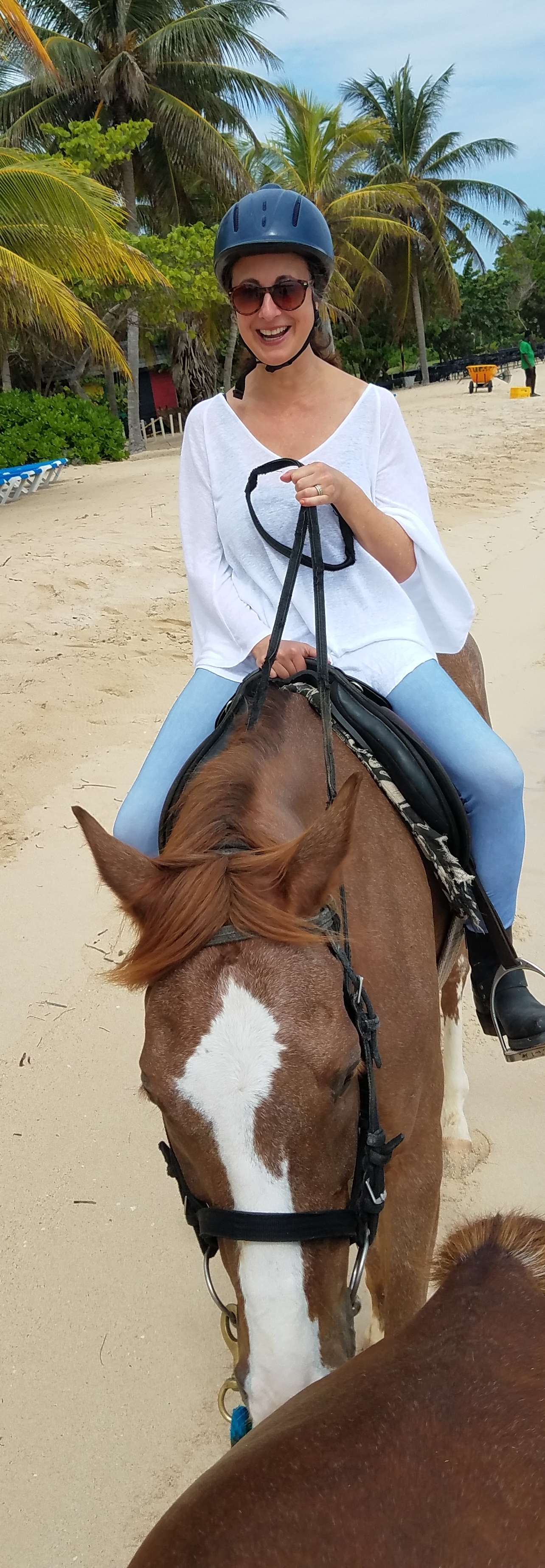 Half Moon's Turf + Surf: a beach stroll with my horse preceding our Caribbean Sea swim - rather, she swims and I hold on for dear life! (Peep the helmet. Safety first, ladies!)