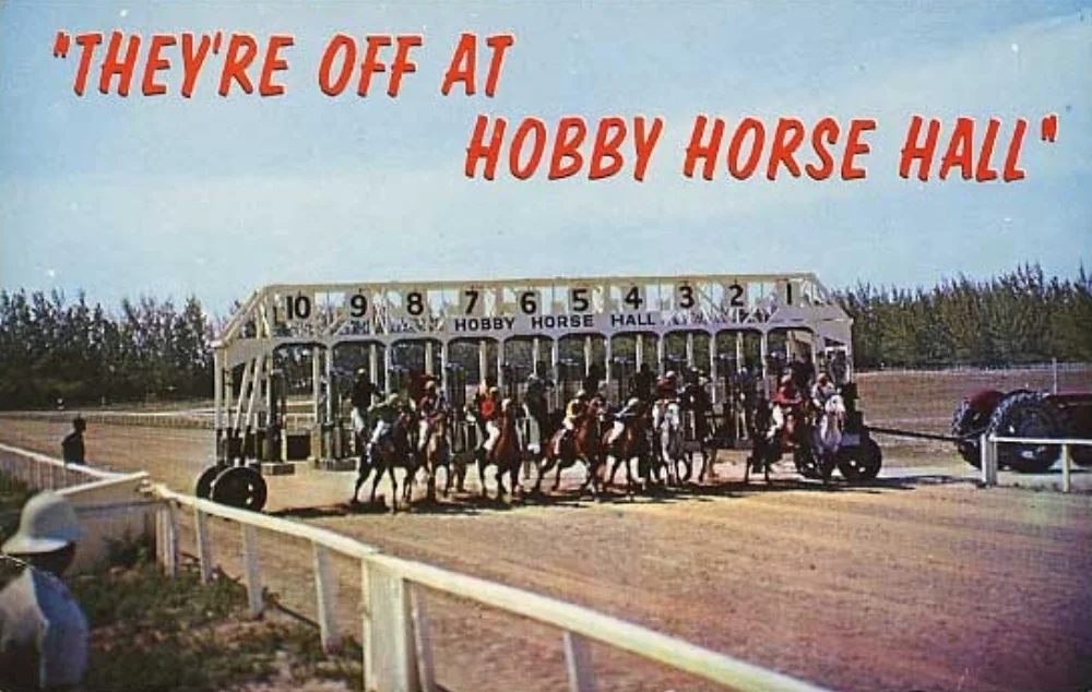 A postcard from 1970 showing the action unfolding at Hobby Horse Hall — "the only race track at its kind in the world."