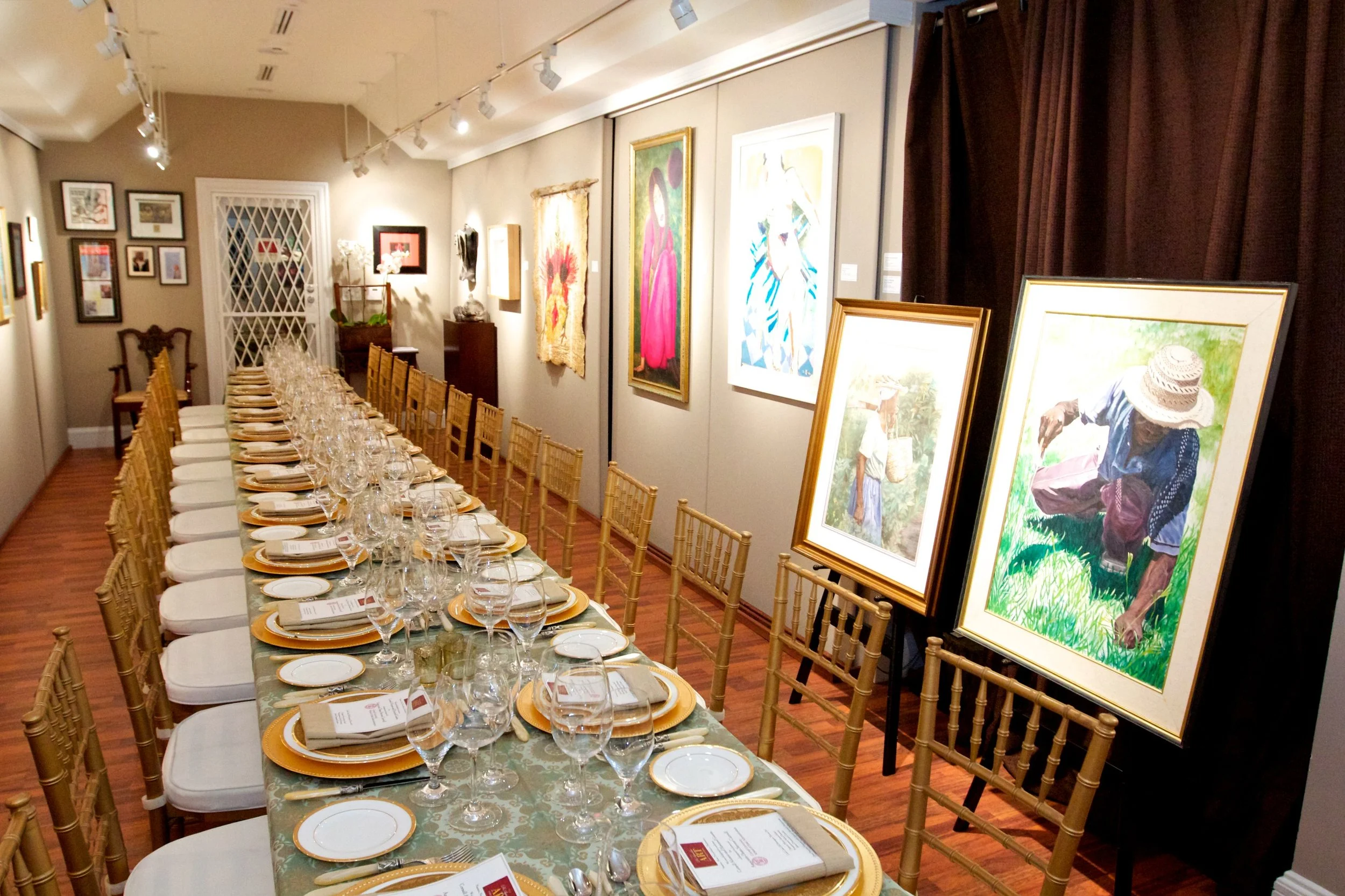 The main gallery space of the D'aguilar Foundation featuring a collection of works by prominent Bahamian artists. 