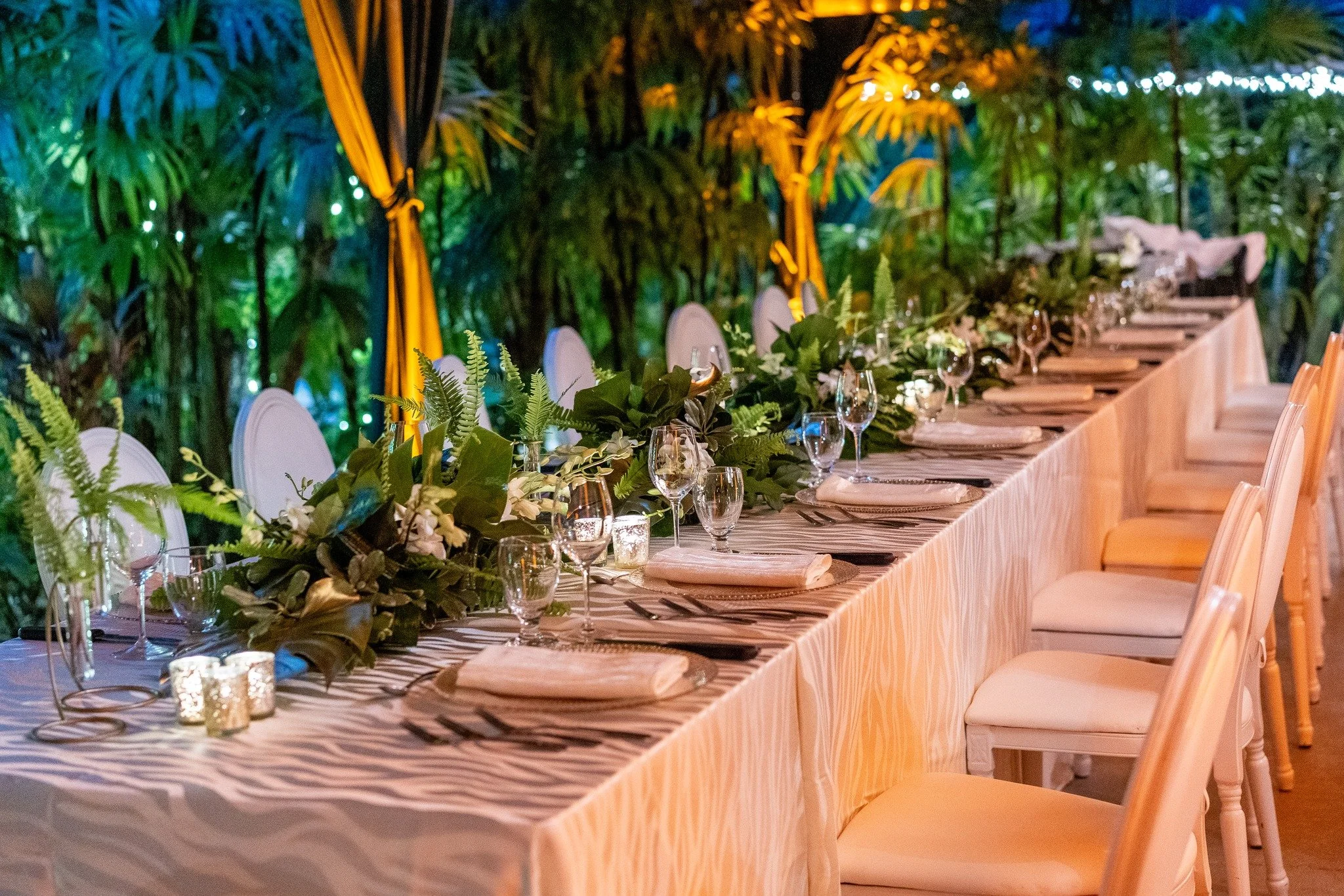 New Year's Eve Dinner, set for the night ahead.

Ivory and gold established the palette across the garden terrace, with lush leaves and orchids chosen to sit comfortably within the surrounding landscape.

Everything considered to create an unhurried 