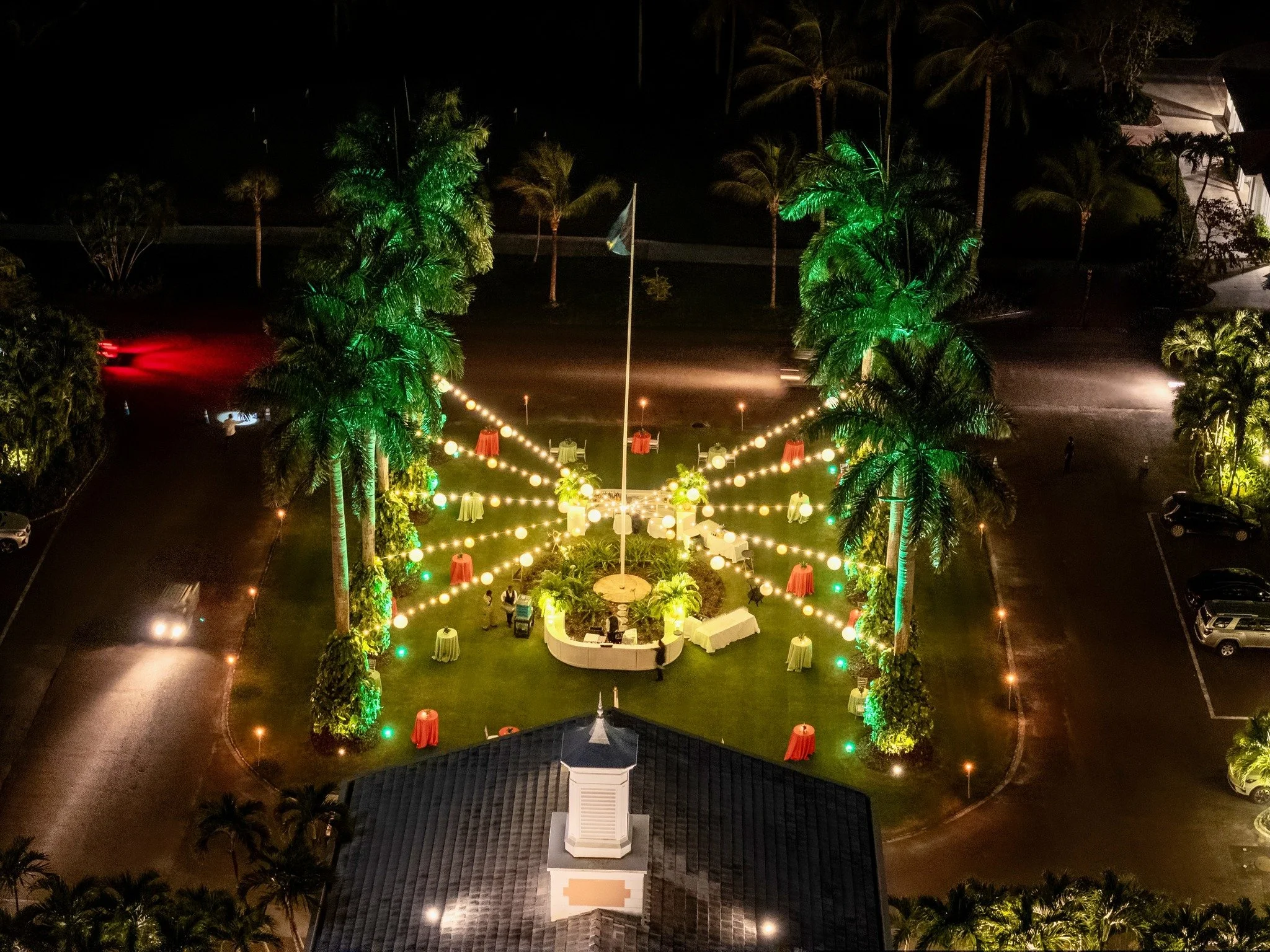 From above, the night comes alive.

Light moving across the lawn, drawing people together. Foliage and form working in concert - the design stretching outward, yet feeling completely at home in its surroundings.

A cocktail setting built for movement