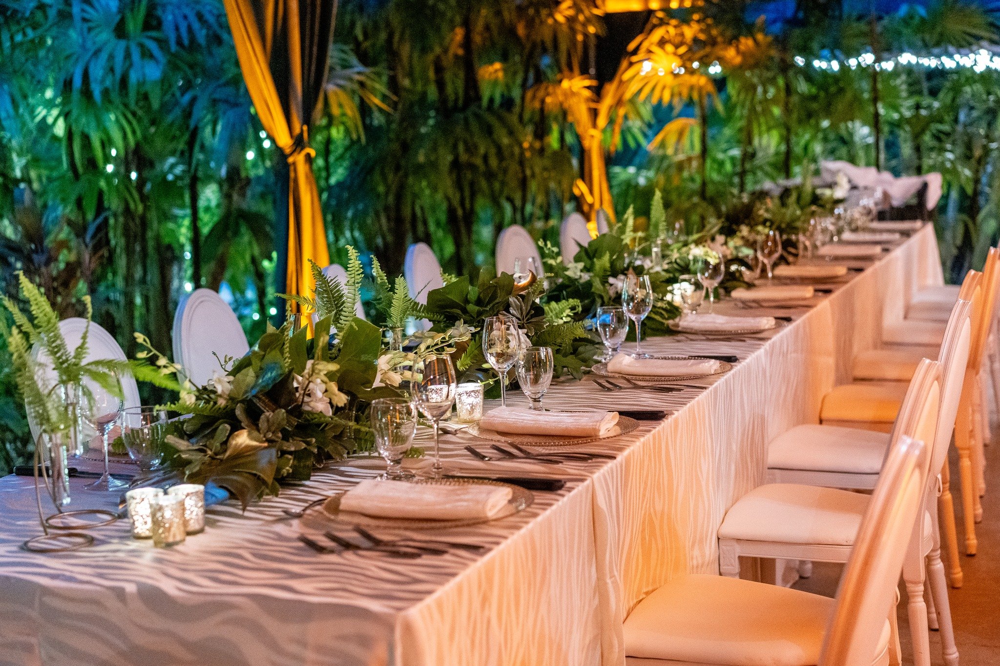 New Year's Eve Dinner, set for the night ahead.

Ivory and gold established the palette across the garden terrace, with lush leaves and orchids chosen to sit comfortably within the surrounding landscape.

Everything considered to create an unhurried 