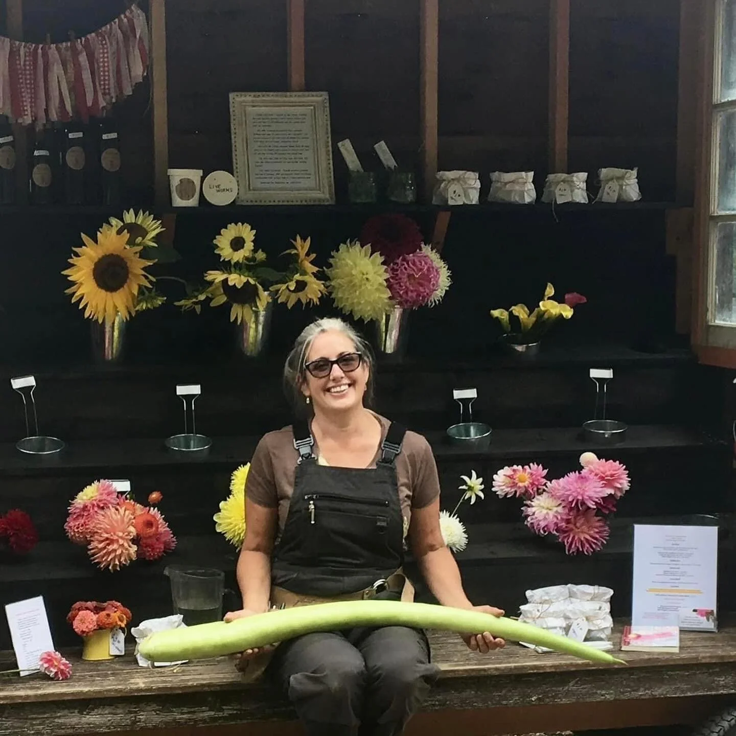 THROWBACK to August 2018, when I first set up my farmstand. This photo of me holding a &ldquo;Tromboncino&rdquo; squash was taken that first morning as I was excitedly stocking the shelves and filling the French market buckets (vases.)

I had been a 