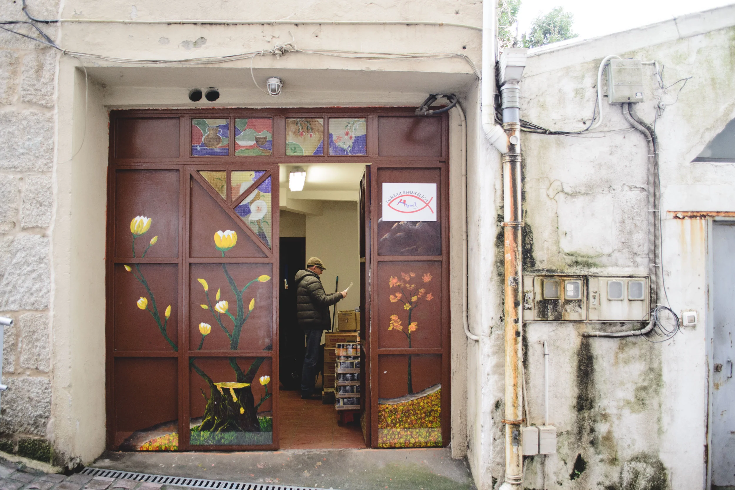 Pastor Davide in the church building in Vigo after receiving a great deal of food for local needy families.