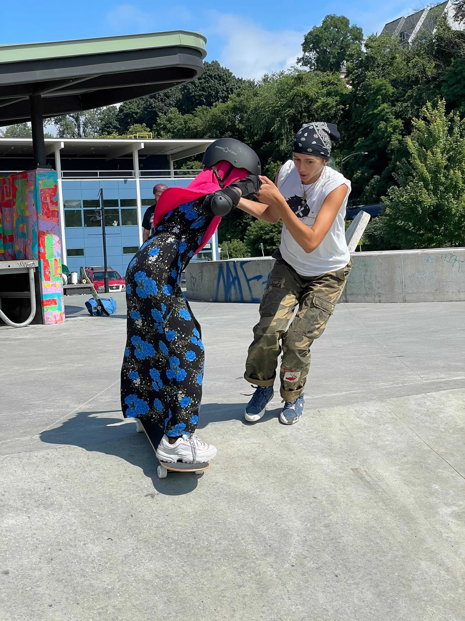 Participant learning skateboard skills through Roll with It