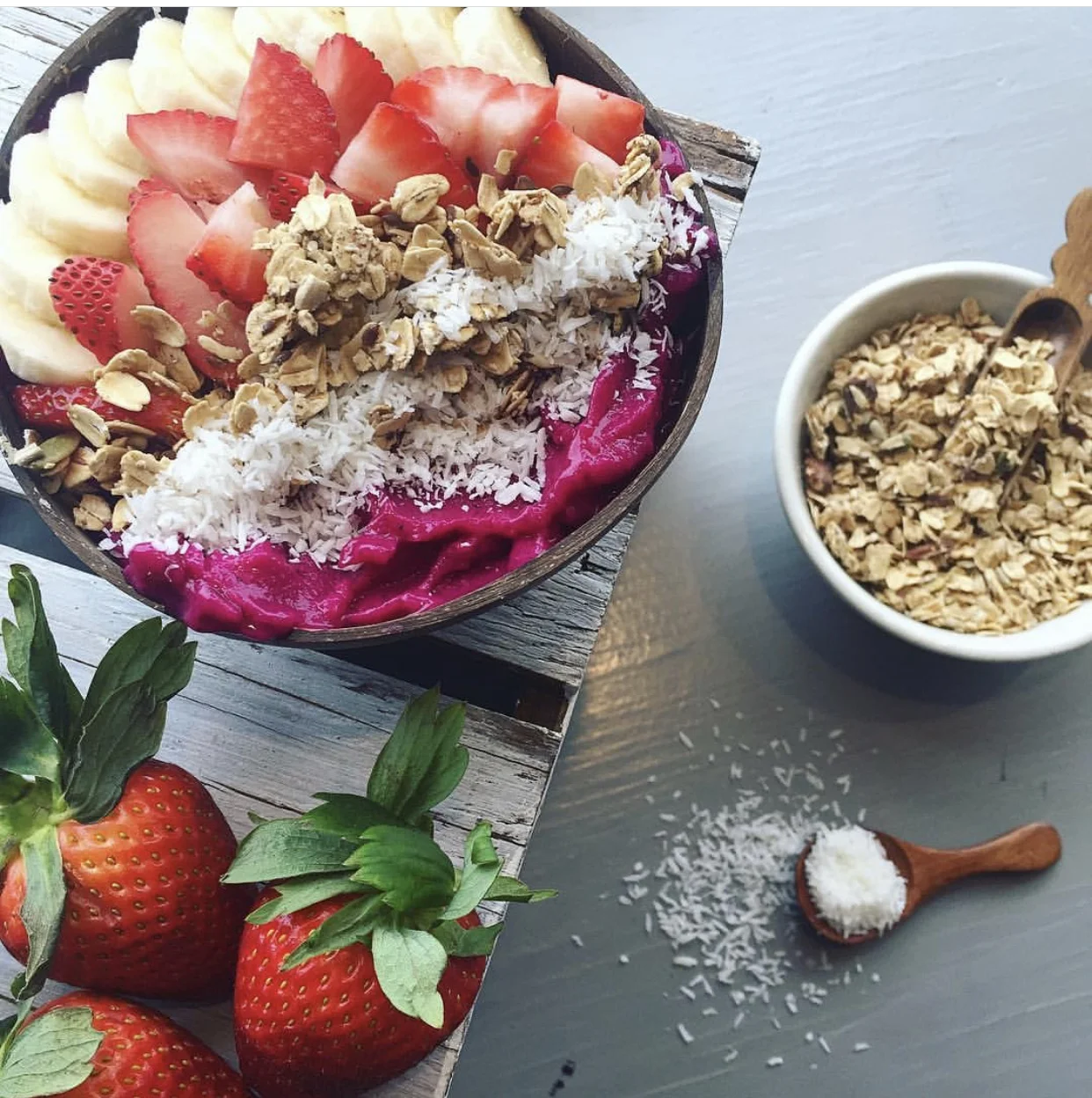 Classic Pitaya Bowl topped with Strawberry, Banana, Gluten Free Granola, & Coconut Flakes