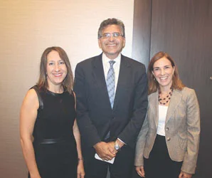 Photo by Cary Shuman - City Manager Tom Ambrosino with Roseann Bongiovanni, executive director of GreenRoots, and Leslie Aldrich, associate director of MGH Center for Community Health Improvement, at the Chamber of Commerce Government Breakfast, where he announced that Chelsea was a recipient of the RWJF Culture of Health Prize.