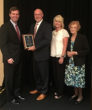 Martin Hatfield named Outstanding County Attorney of the Year at the 2016 Kentucky Prosecutors Conference. Only 2 County Attorneys out of 120 counties were chosen for the honor presented by Attorney General Andy Beshear. Martin was surprised with the presence of his wife Debbie and his mother Lois when he received the prestigious award.
