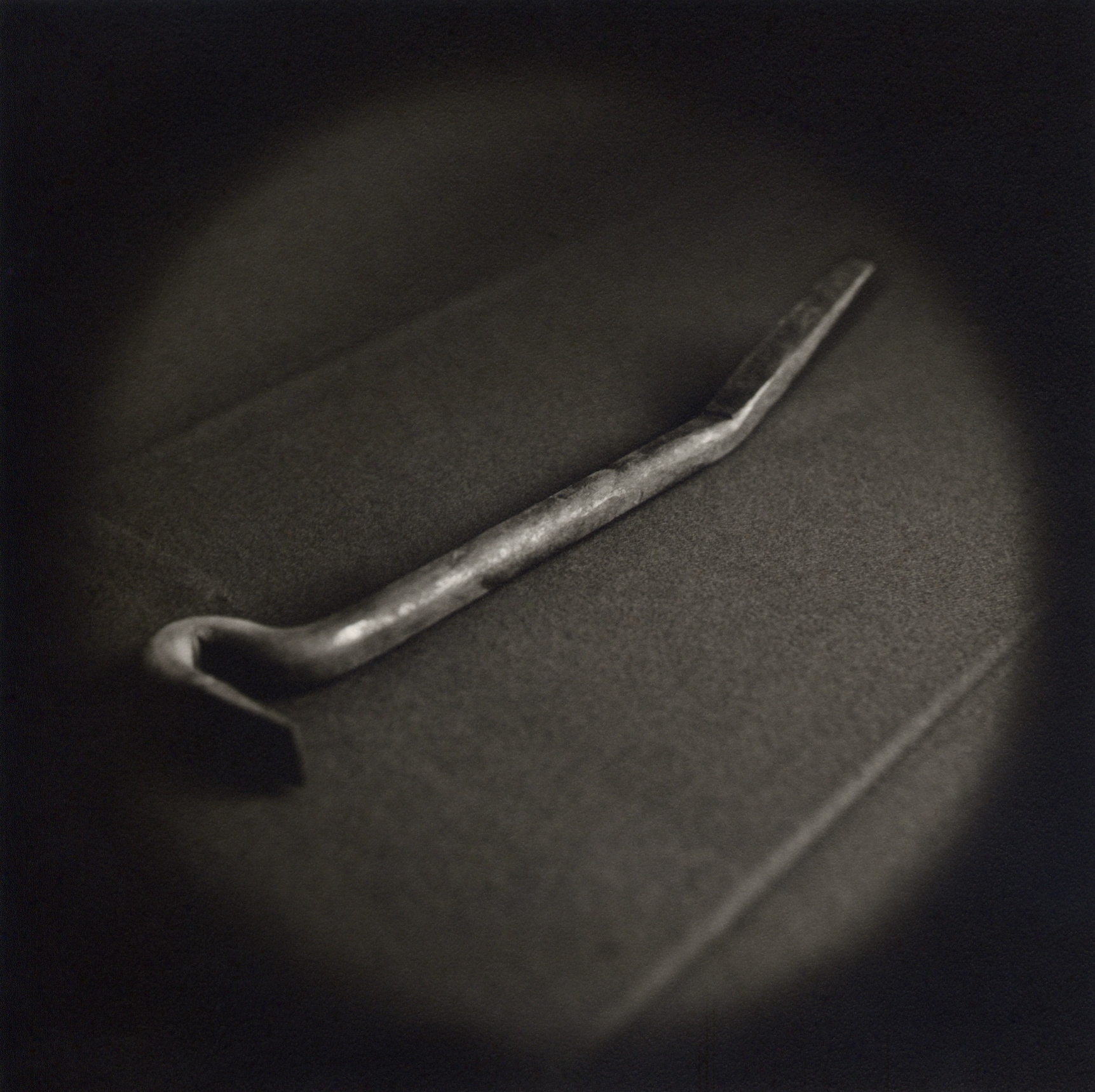   Crowbar, tool used to force entry    Toned gelatin silver print.   16 x 16 in. (40 x 40 cm.) 