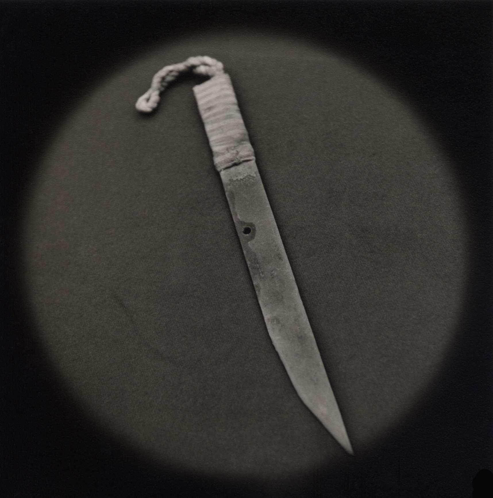   Improvised knife made from prison bed frame   Toned gelatin silver print.   16 x 16 in. (40 x 40 cm.) 