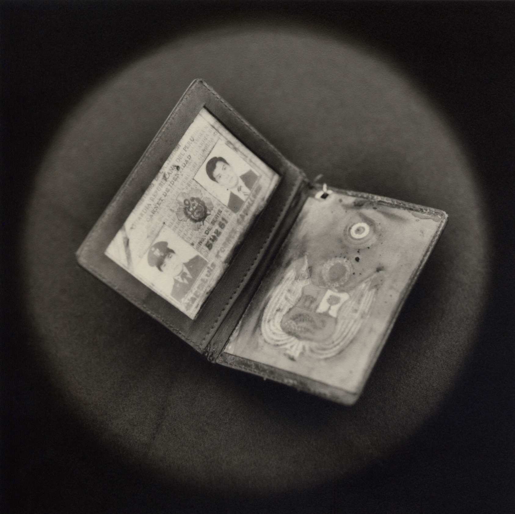   Fake police ID used by terrorist    Toned gelatin silver print.   16 x 16 in. (40 x 40 cm.) 