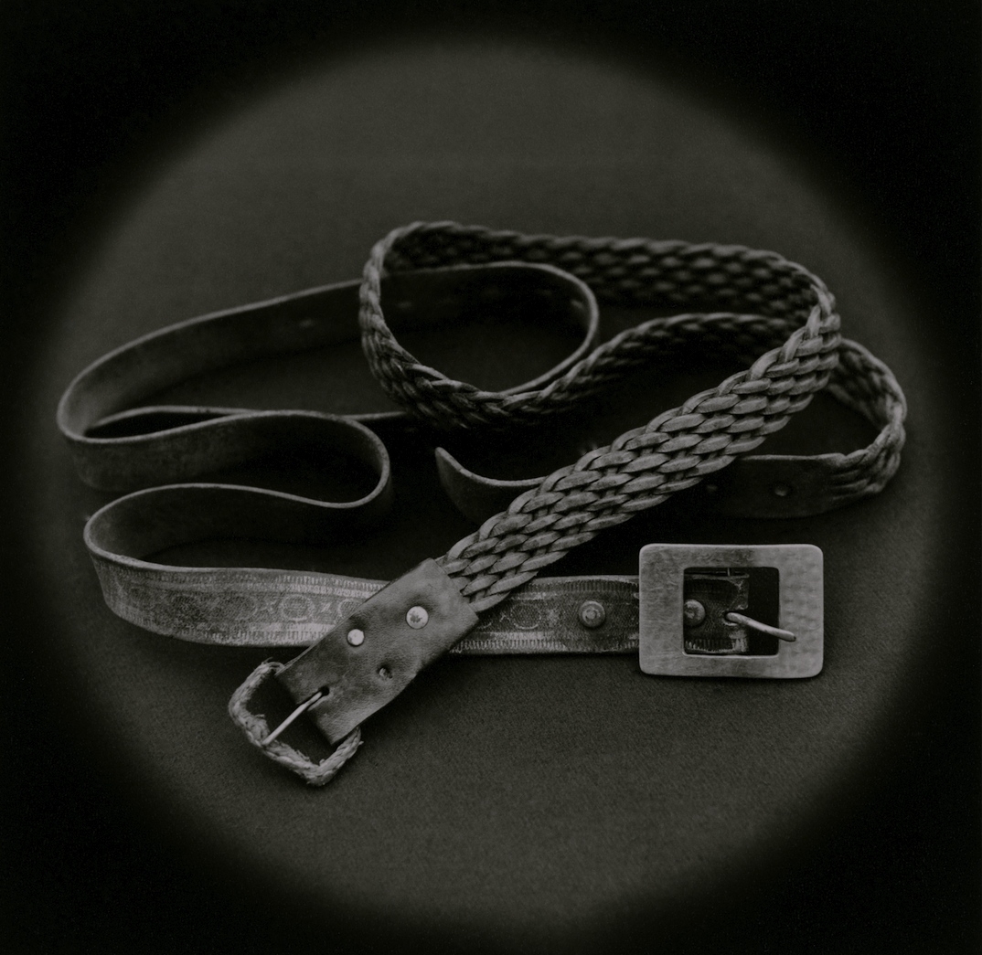   Belts used by psychologist Mario Poggi to strangle a rapist during police interrogation    Toned gelatin silver print.   16 x 16 in. (40 x 40 cm.) 