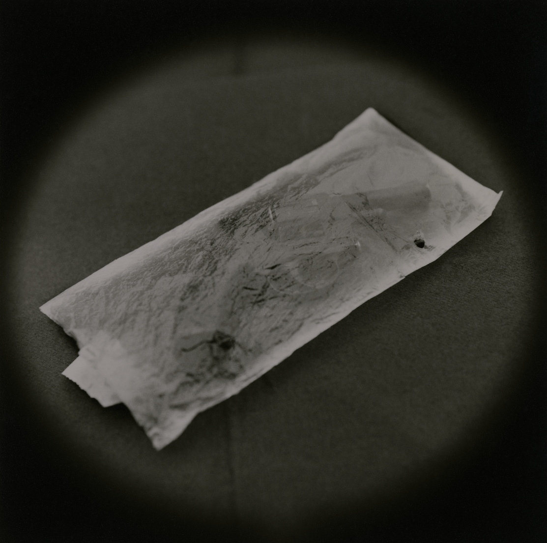   Handgun, incriminating evidence of murder    Toned gelatin silver print.   16 x 16 in. (40 x 40 cm.) 