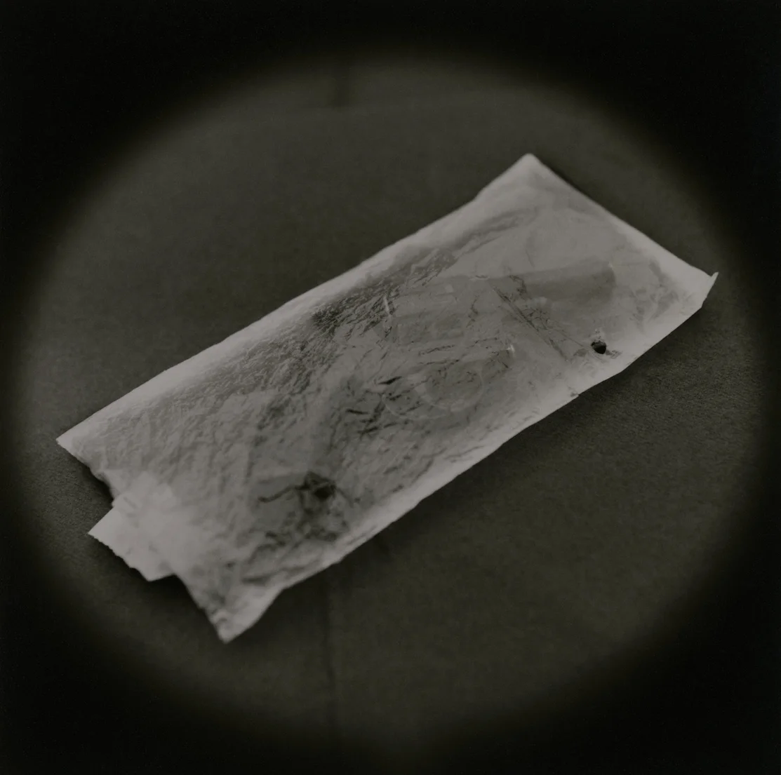 The Lost Steps (Handgun, incriminating evidence of murder) Toned gelatin silver print. 16 x 16 in. 