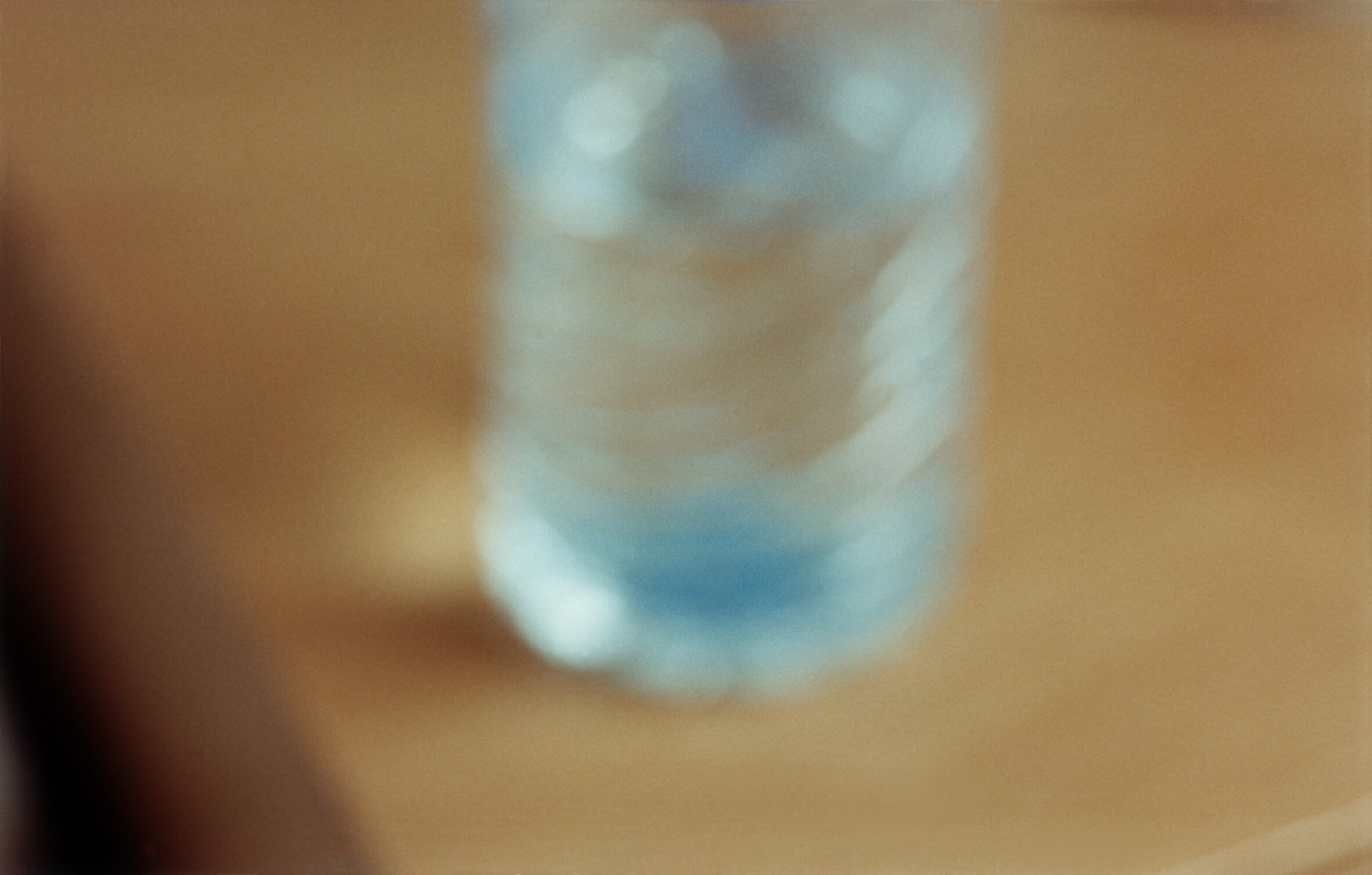   Water bottle on the night table,  2001  Archival pigment print on cotton paper  13 x 21.7 in. on 19.7 x 27.6 in. paper (33 x 55 cm. on  50 x 70 cm.) 