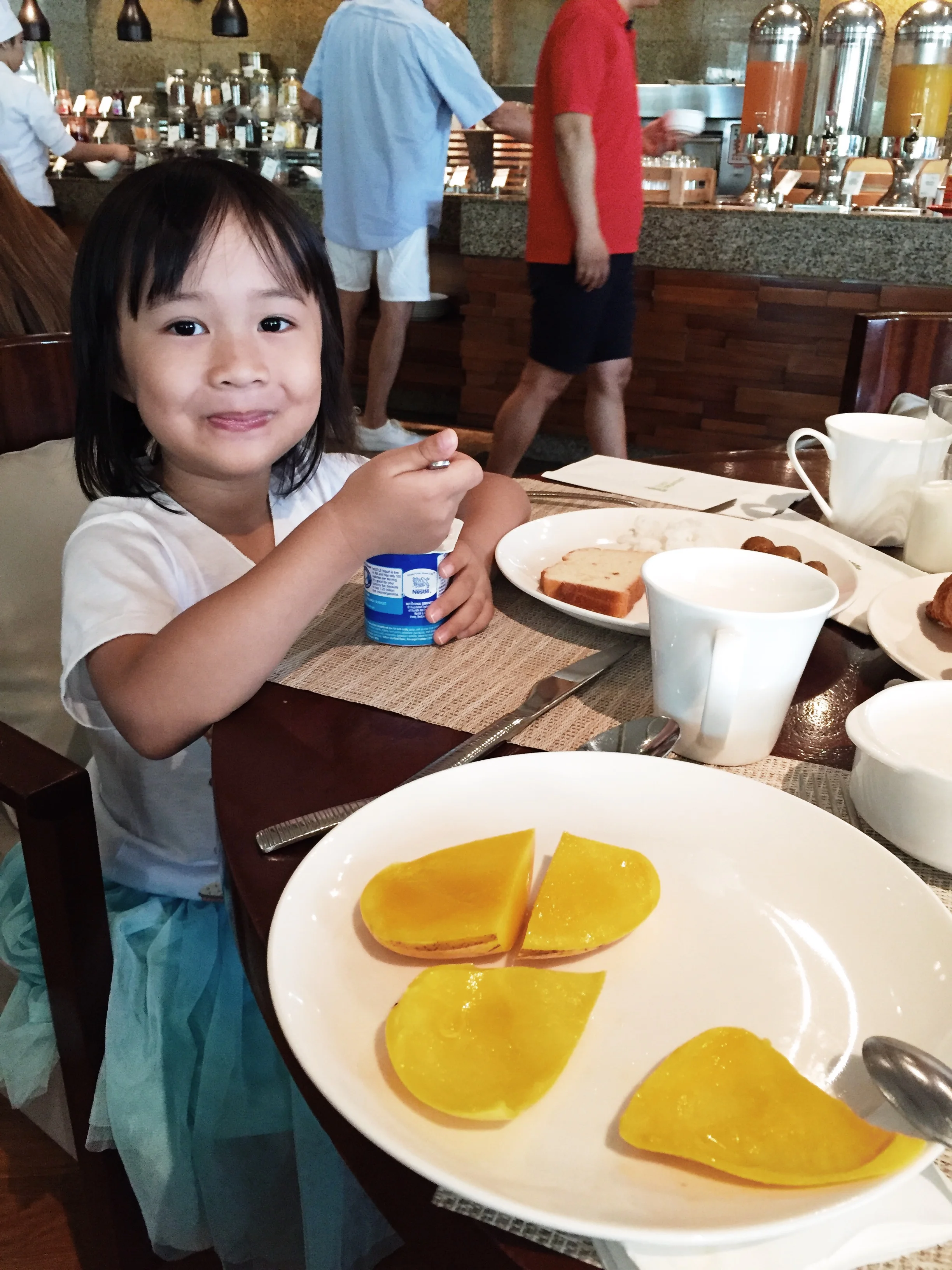 Rise and shine the next morning! Rae loves scooping out the fresh super sweet mangoes and put them in her yogurt! 